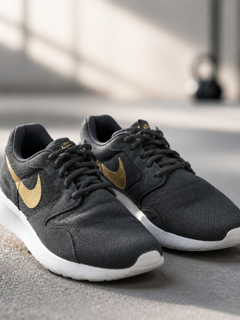 Nike Women’s Black and Gold Low-Top Athletic Sneakers